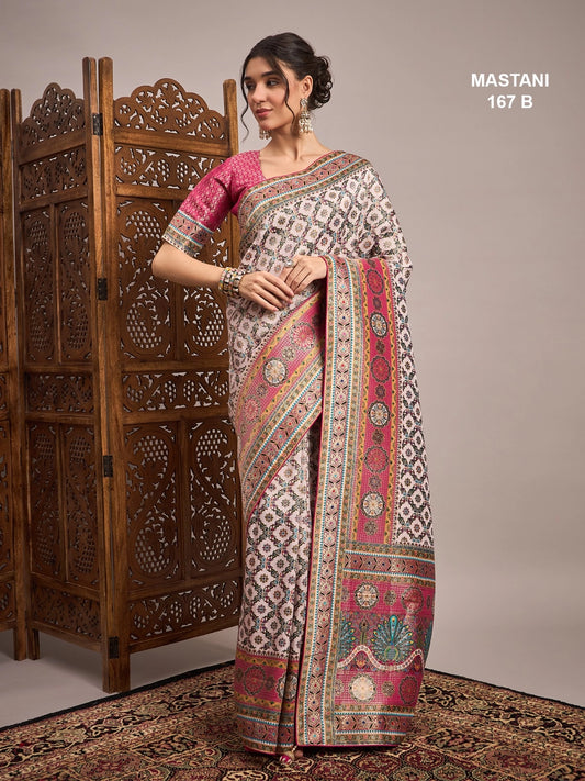 Woman wearing a traditional saree with intricate patterns in a decorative setting.