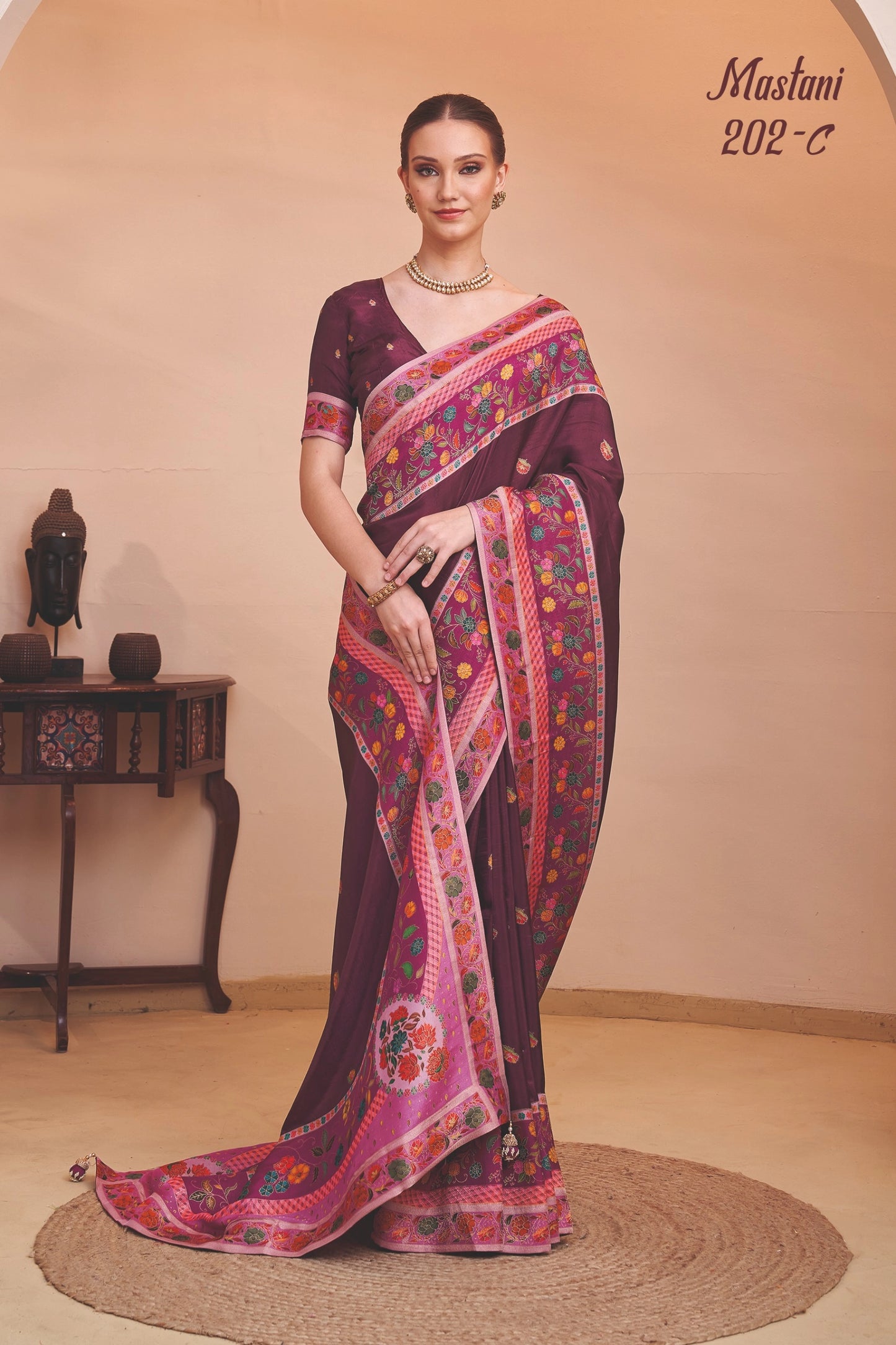 Woman wearing a colorful saree with a blurred background
