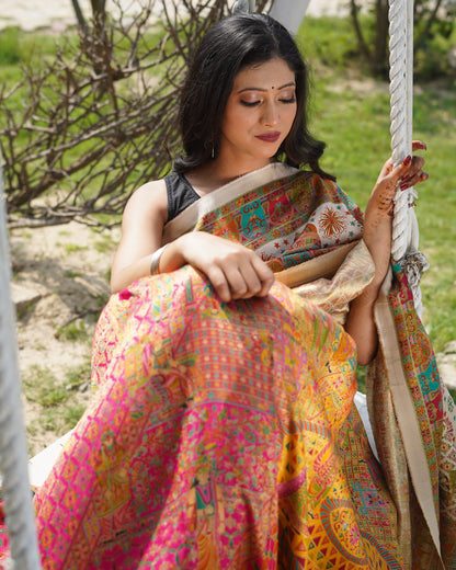 Woman in a colorful dress sitting on a swing with a natural background
