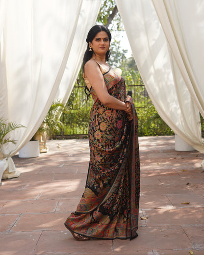 Woman in a floral dress standing near white curtains outdoors