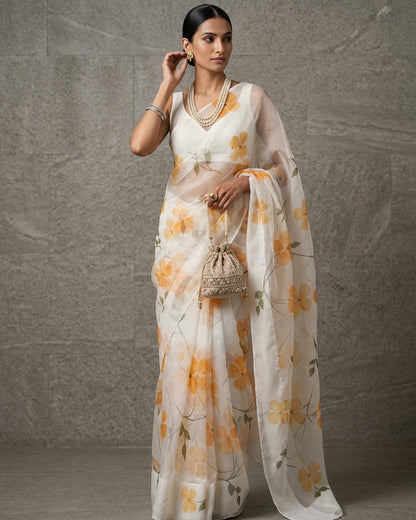 Woman wearing a floral saree with a plain background
