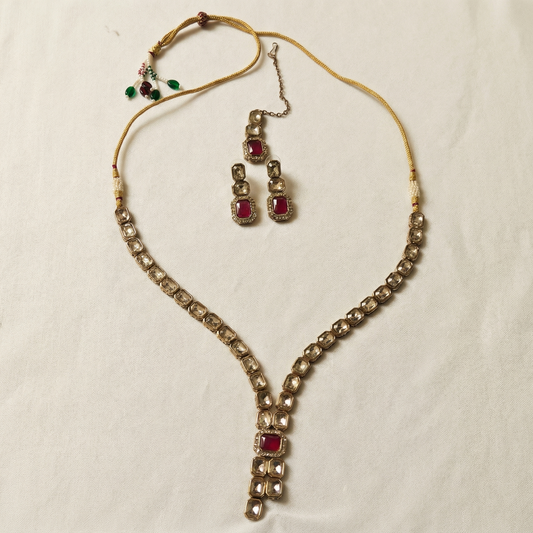 Jewelry set with necklace and earrings on a light background