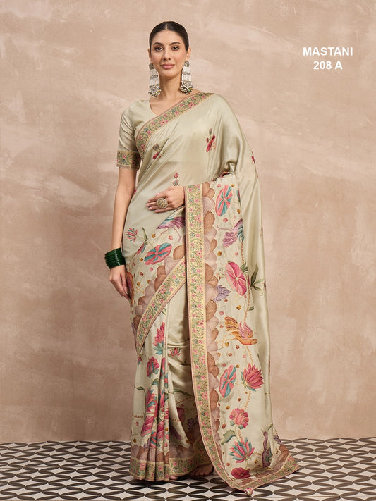 Woman wearing a light green saree with floral patterns on a beige background