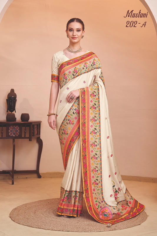 Woman wearing a traditional saree with floral patterns in a room setting