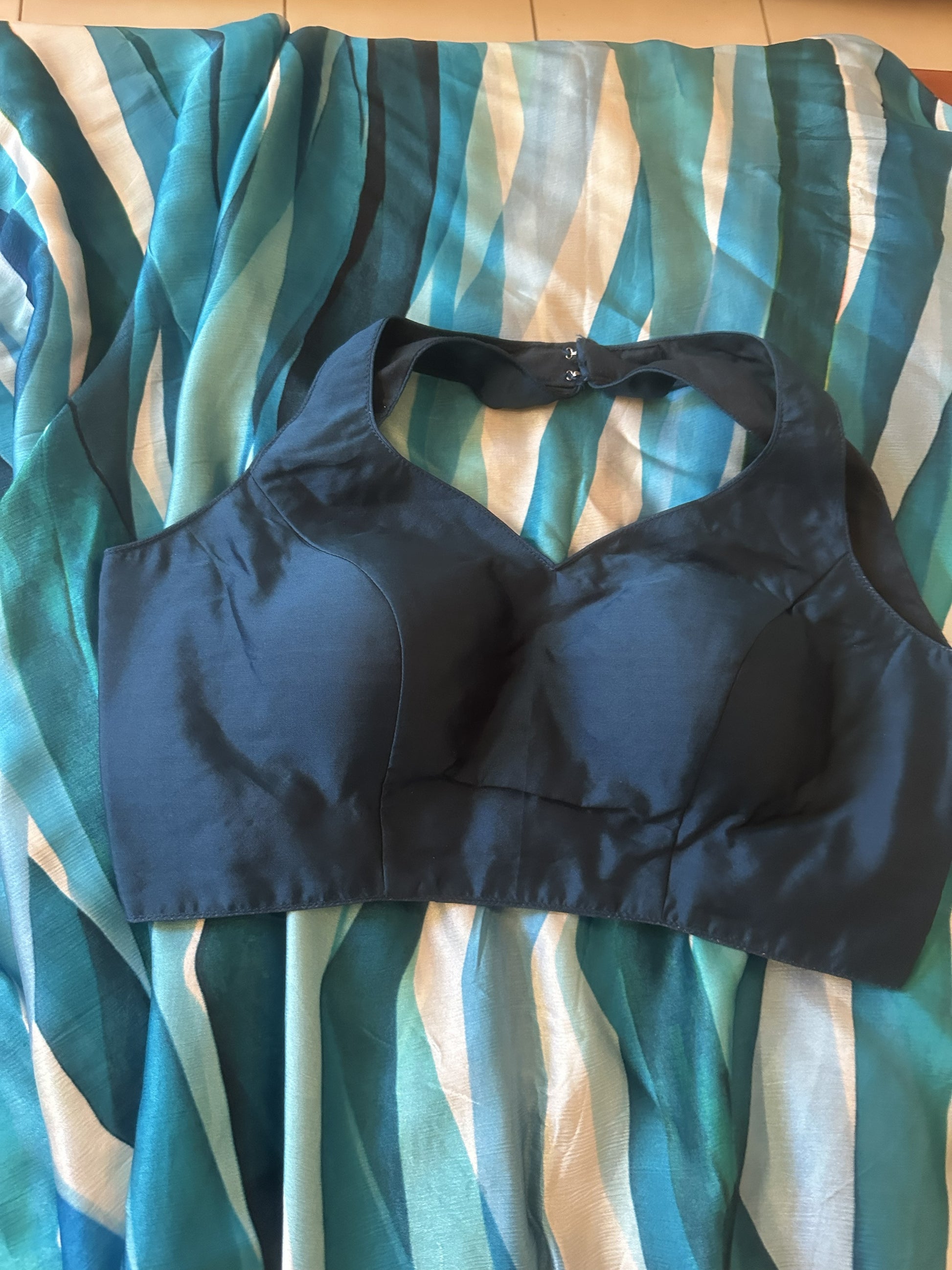 Black sports bra on a striped fabric background